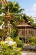 Thailand: Walking Buddha statue and Southern-style wooden Thai house, Wat Sao Thong, Nakhon Sri Thammarat